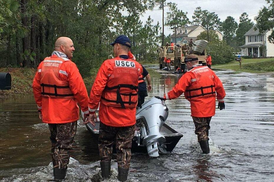 US Coast Guard Officers Bradley and Tindol on site to assess flood damage.