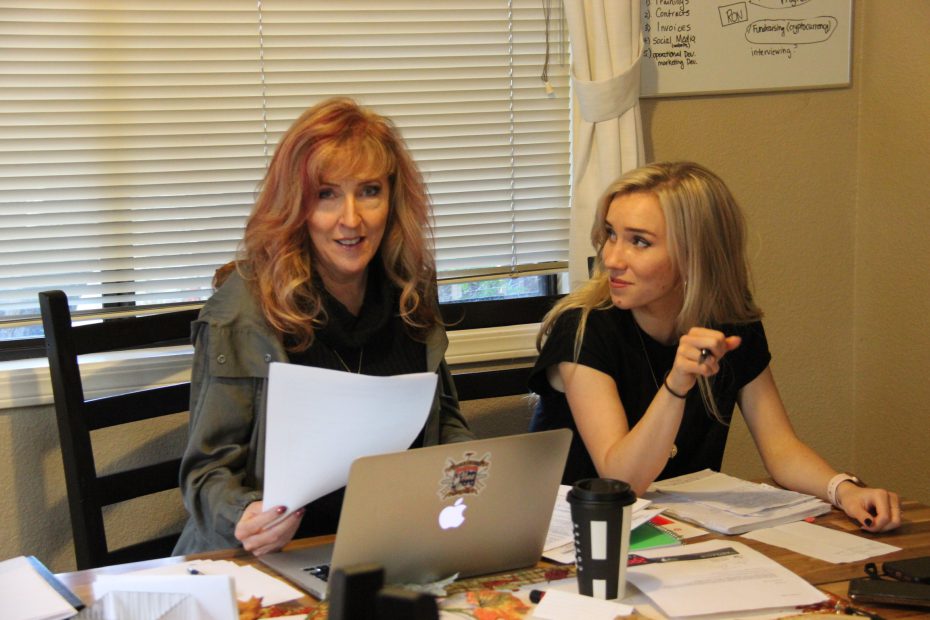 Perimeter CEO Bailey Farren works at a desk with her mother, Susan Farren, founder of First Responder Resiliency, Inc.